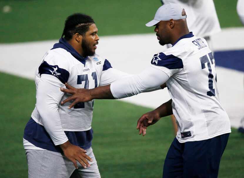 FILE - Cowboys offensive tackles La'el Collins (left) and Tyron Smith work out together as...
