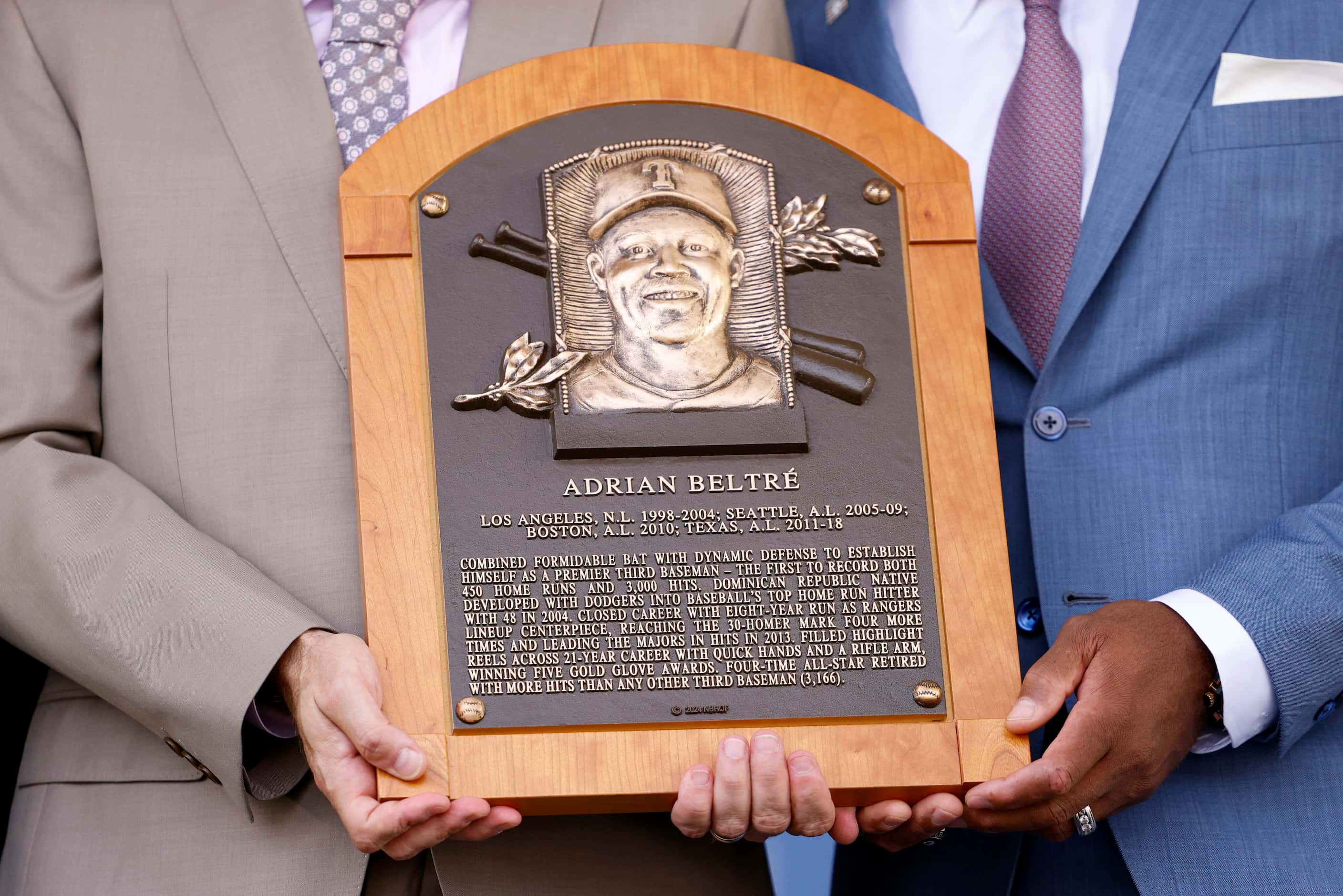 Former Texas Rangers third baseman Adrián Beltré holds his National Baseball Hall of Fame...