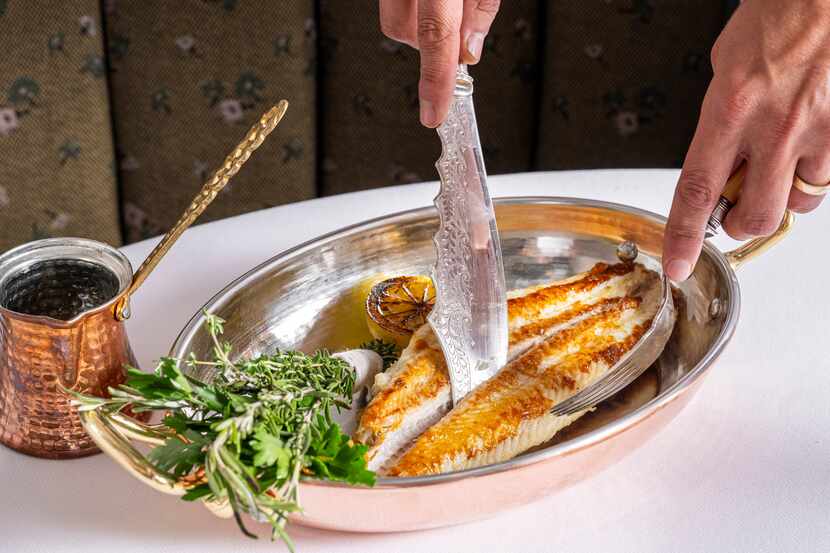 Fish is fileted tableside at Mister Charles, the newest restaurant on Dallas' Knox Street as...