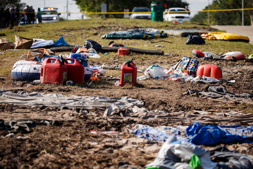 Debris left behind from the evacuation litters the median of Mason Road near the entrance to...