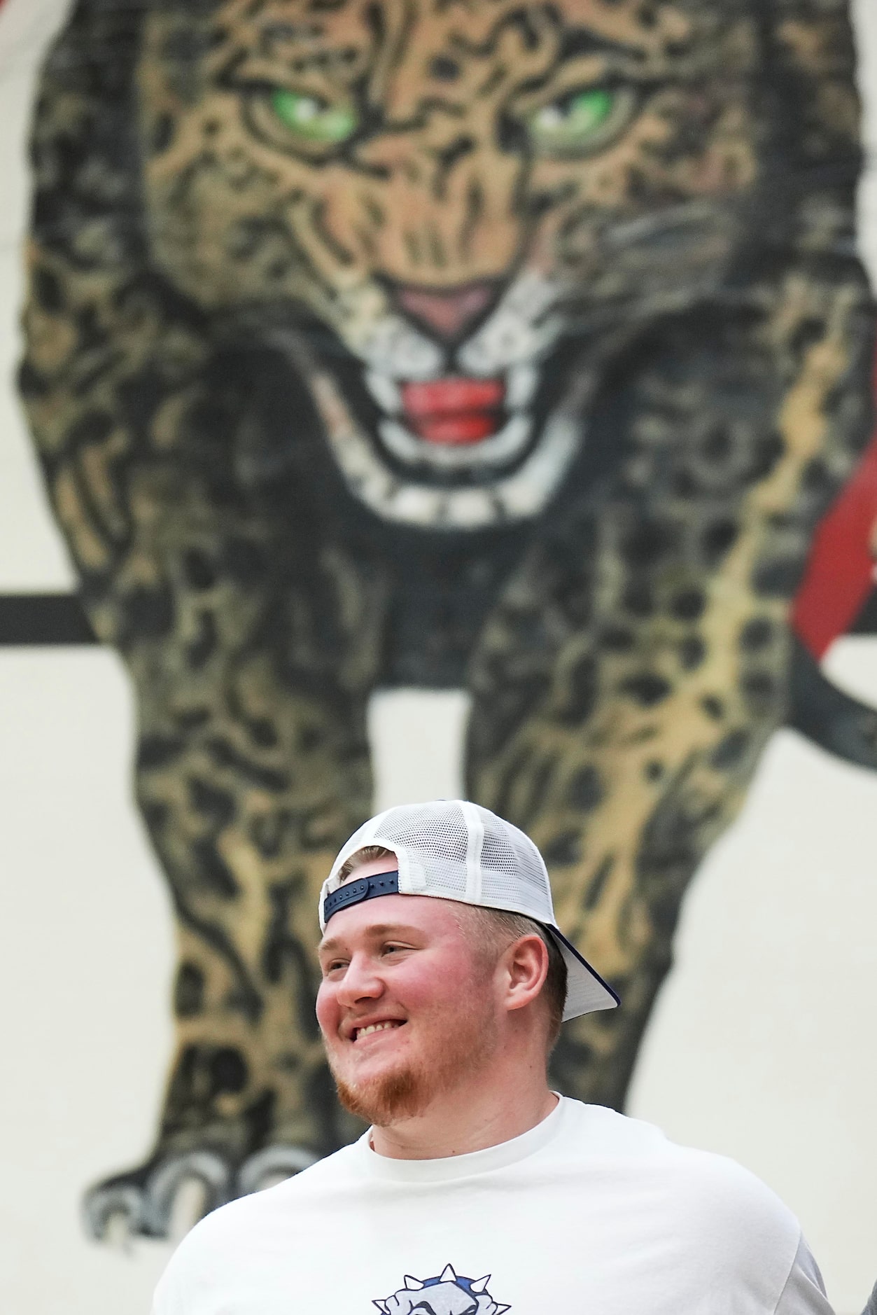 Lovejoy all-state offensive lineman Sam Reynolds smiles while posing for a photo during a...