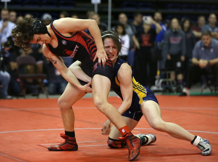 Euless Trinity's Mack Beggs (left), a transgender male, wrestles Cypress Ranch's Kayla Fitts...