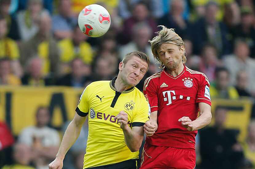 Dortmund's Jakub Blaszczykowski of Poland, left, and Bayern's Anatoliy Tymoshchuk of the...
