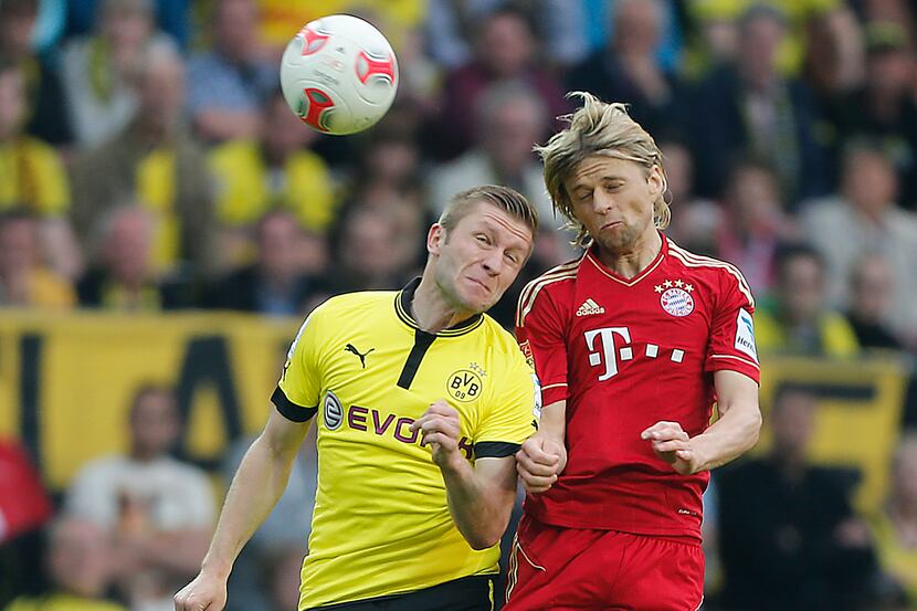 Dortmund's Jakub Blaszczykowski of Poland, left, and Bayern's Anatoliy Tymoshchuk of the...