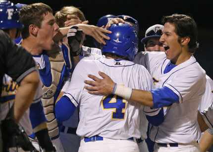 Frisco's Ryan Vilade is congratulated by teammates after hitting a solo home run during the...