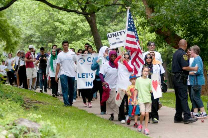 
Marchers participated in the Walk Against Islamophobia on Saturday along Turtle Creek in...