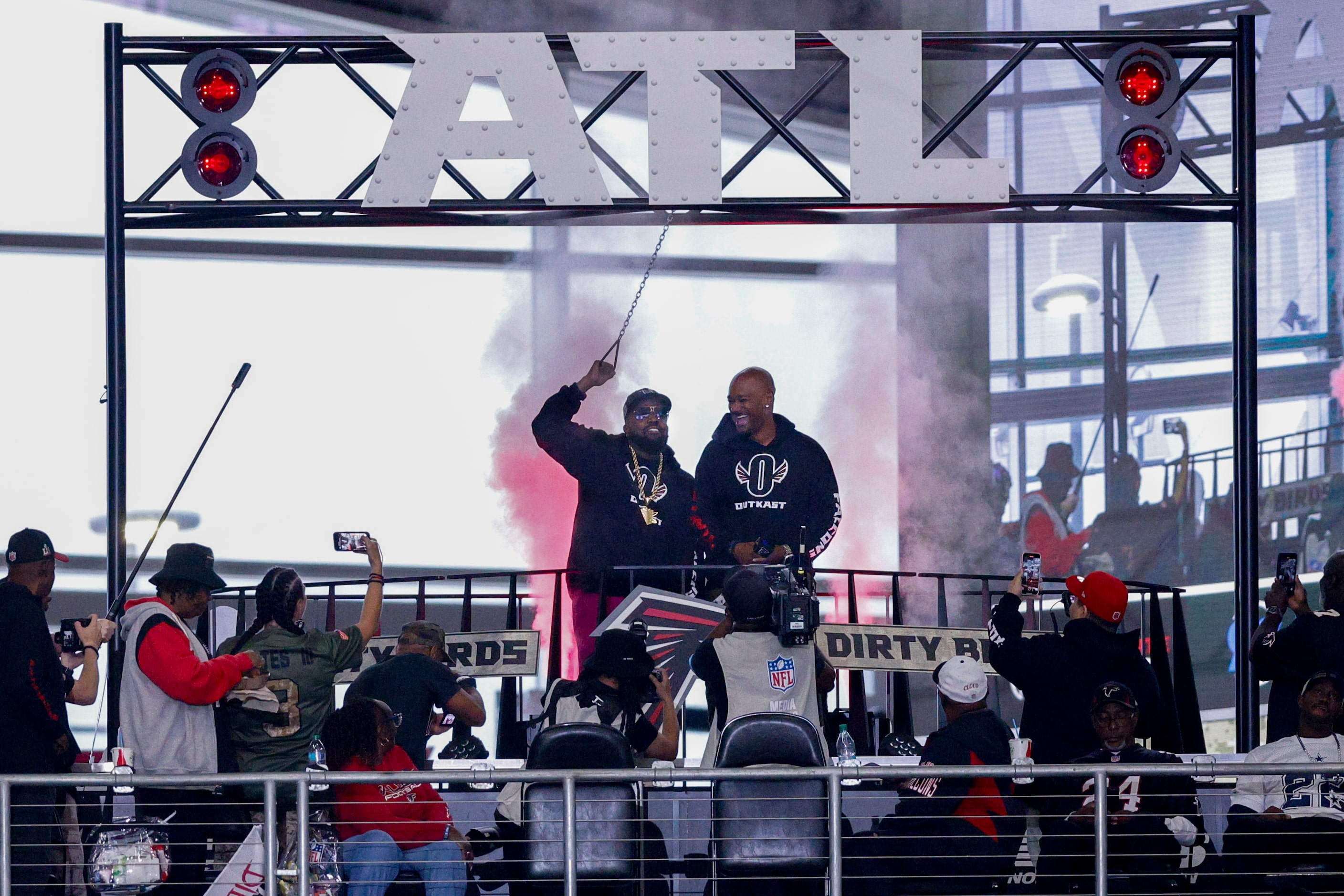 Rapper Big Boi (left) blows the Atlanta Falcons train horn before a game against the Dallas...