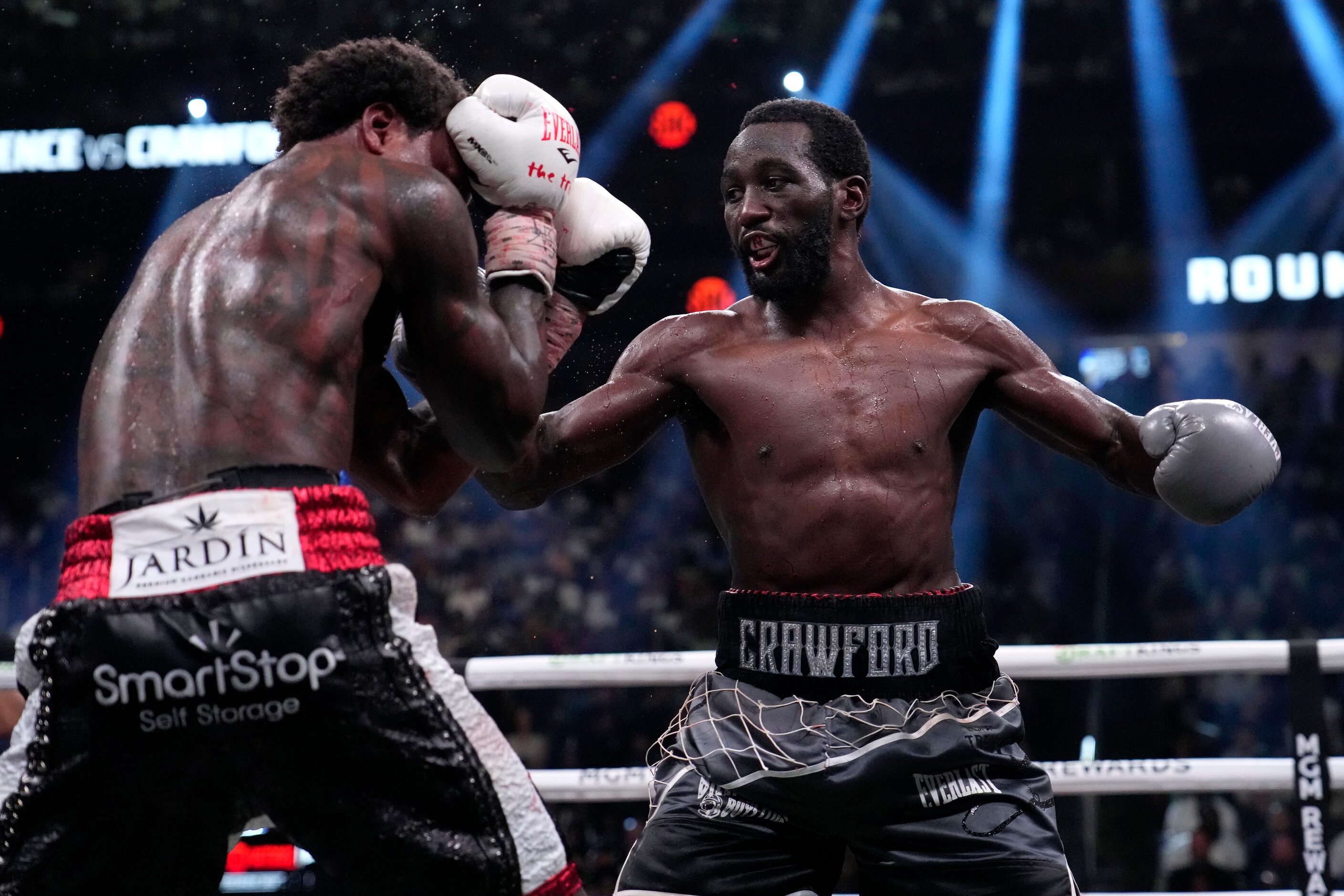 Terence Crawford, right, and Errol Spence Jr. fight during their undisputed welterweight...