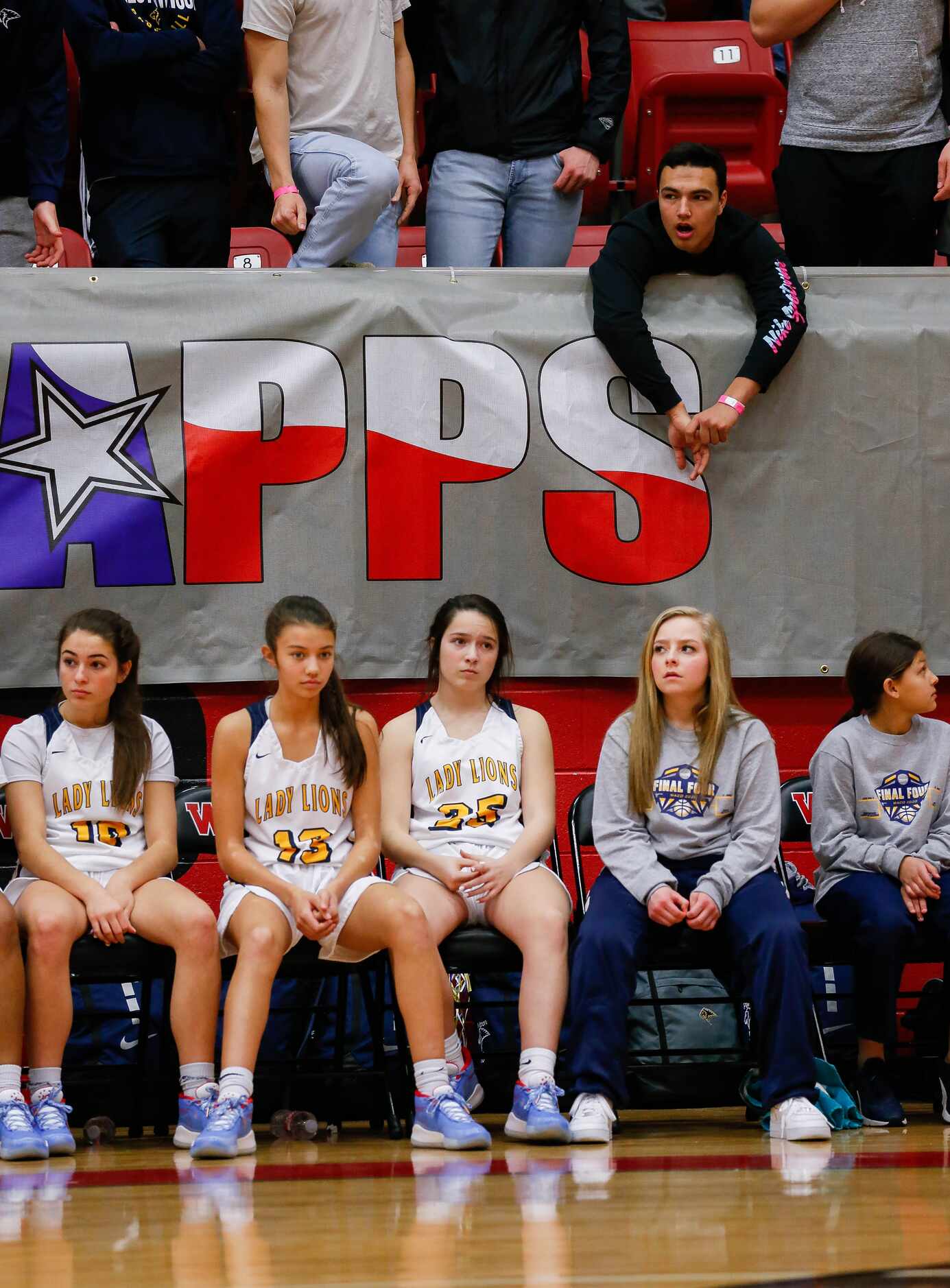 Plano Prestonwood Christian players and fans look dejected as they fall behind during the...