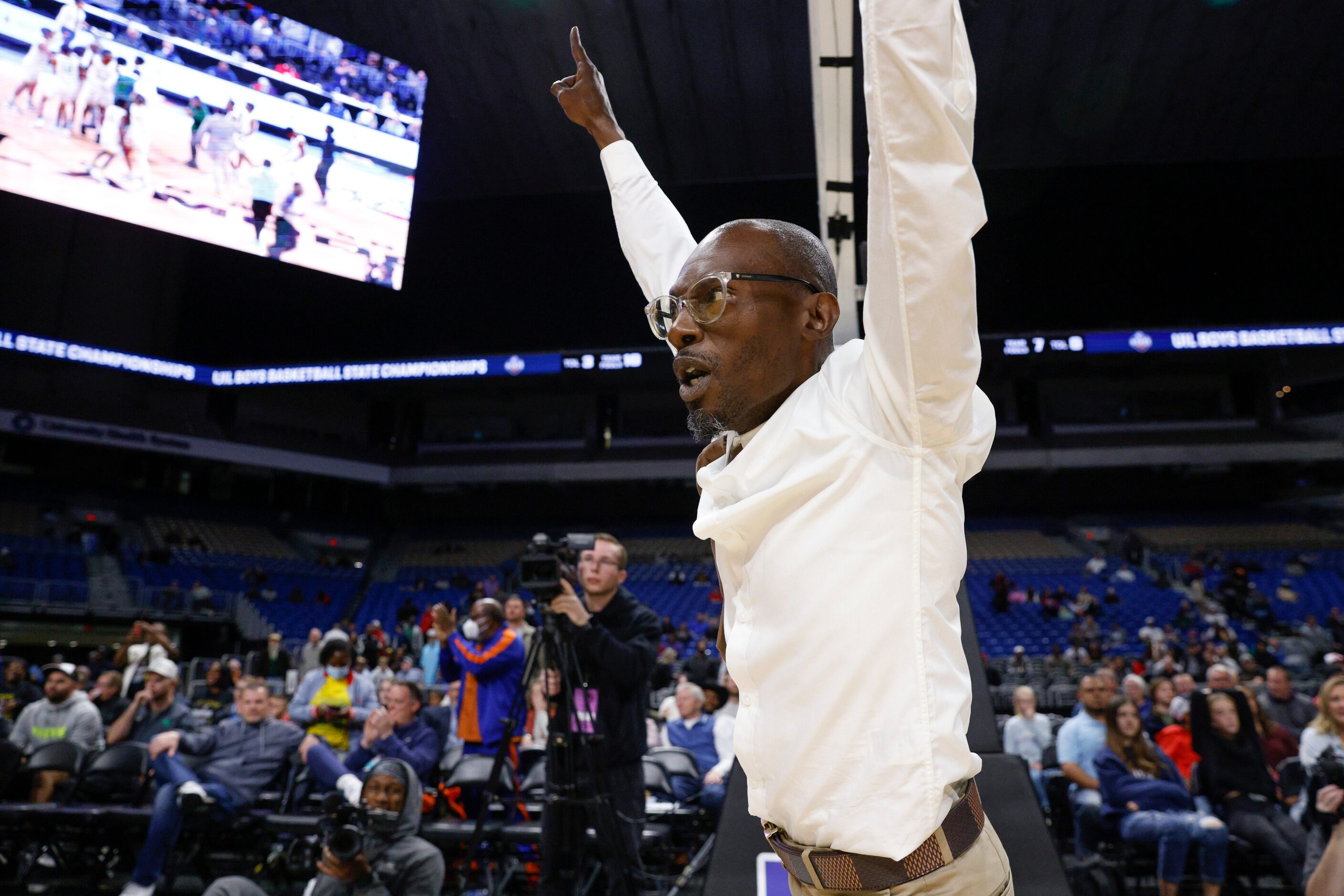 Madison head coach Damien Mobley celebrates winning the Class 3A state championship game...