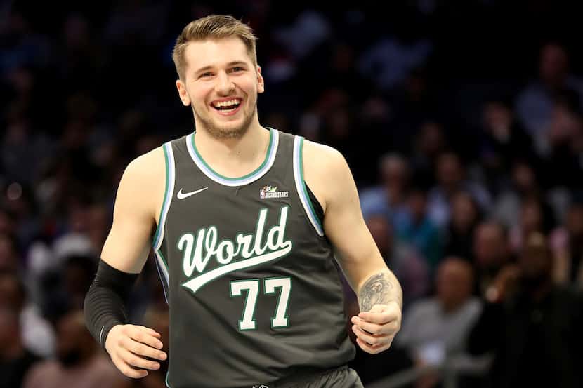 CHARLOTTE, NORTH CAROLINA - FEBRUARY 15: Luka Doncic #77 of the World Team reacts during the...
