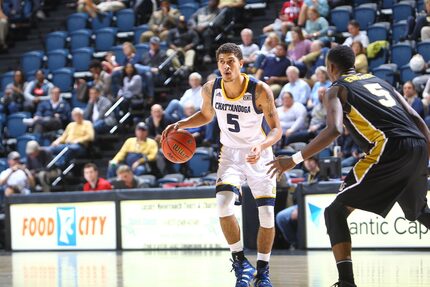 Nat Dixon  playing basketball for Tennessee-Chattanooga.