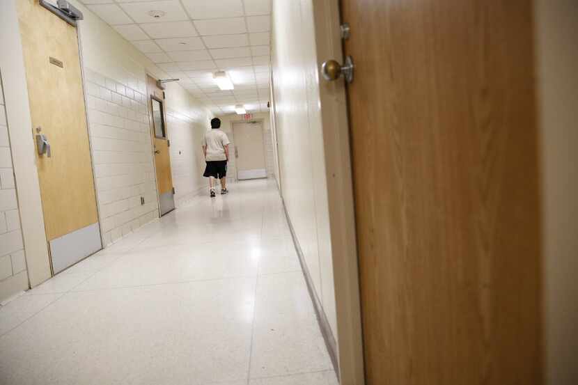 A patient walks down the hallway in the forensic ward at the Terrell State Hospital in...