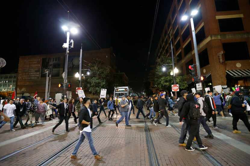 Protesters against President-elect Donald Trump march in downtown Dallas, Thursday, Nov. 10,...