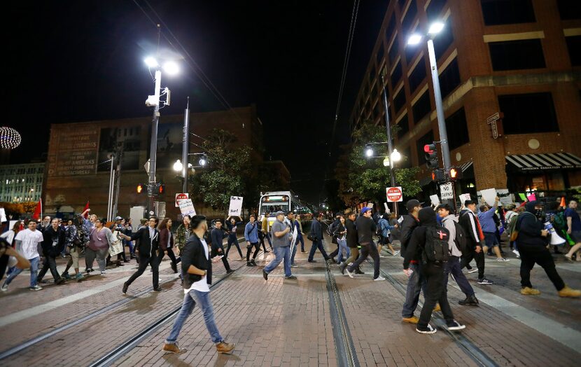 Protesters against President-elect Donald Trump march in downtown Dallas, Thursday, Nov. 10,...