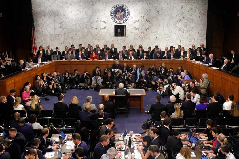 Attorney General Jeff Sessions, center, testified before the Senate Intelligence Committee...