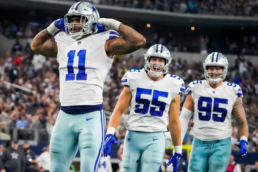 Dallas Cowboys linebacker Micah Parsons (11) celebrates with outside linebacker Leighton...