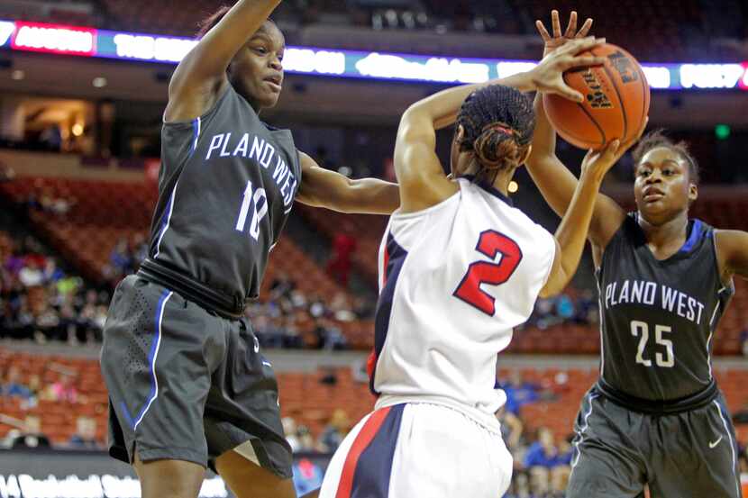 Plano West guard Azia Lacy (10) and guard Sydney Skinner (25) defend again Manvel forward...