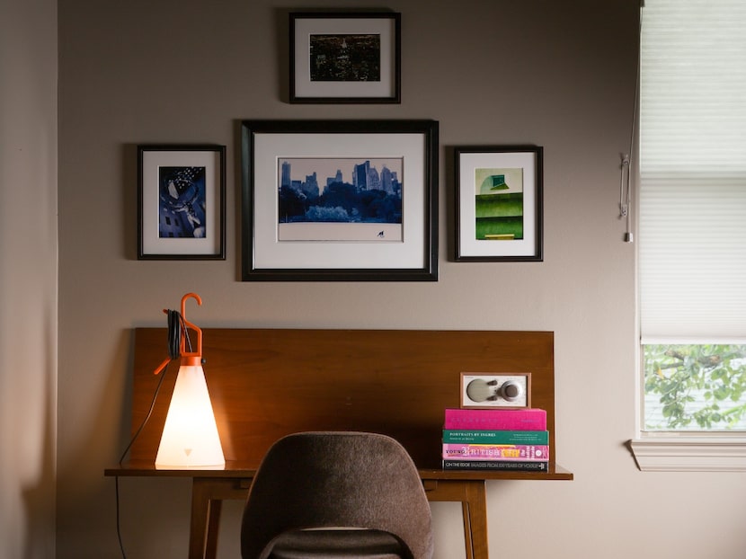 Warm neutral walls with a wooden desk and chair by a window