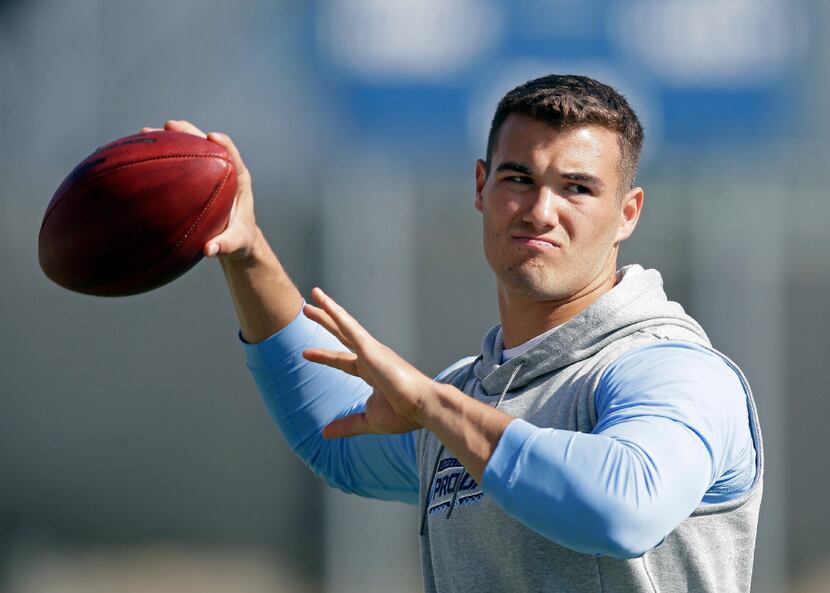 FILE - In this March 21, 2017, file photo, quarterback Mitch Trubisky winds up for a pass...