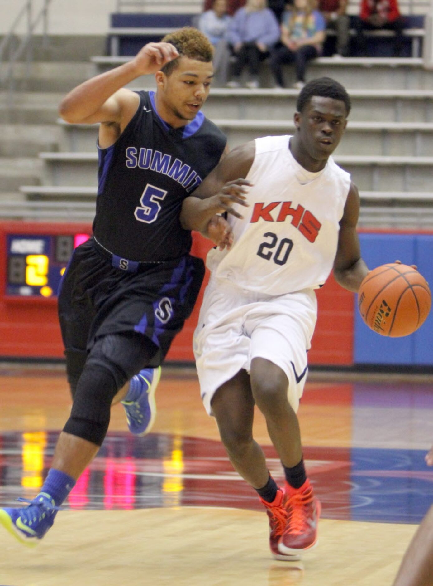 Dallas Kimball forward Xaiver Johnson (20) brings the ball up court as Mansfield Summit...