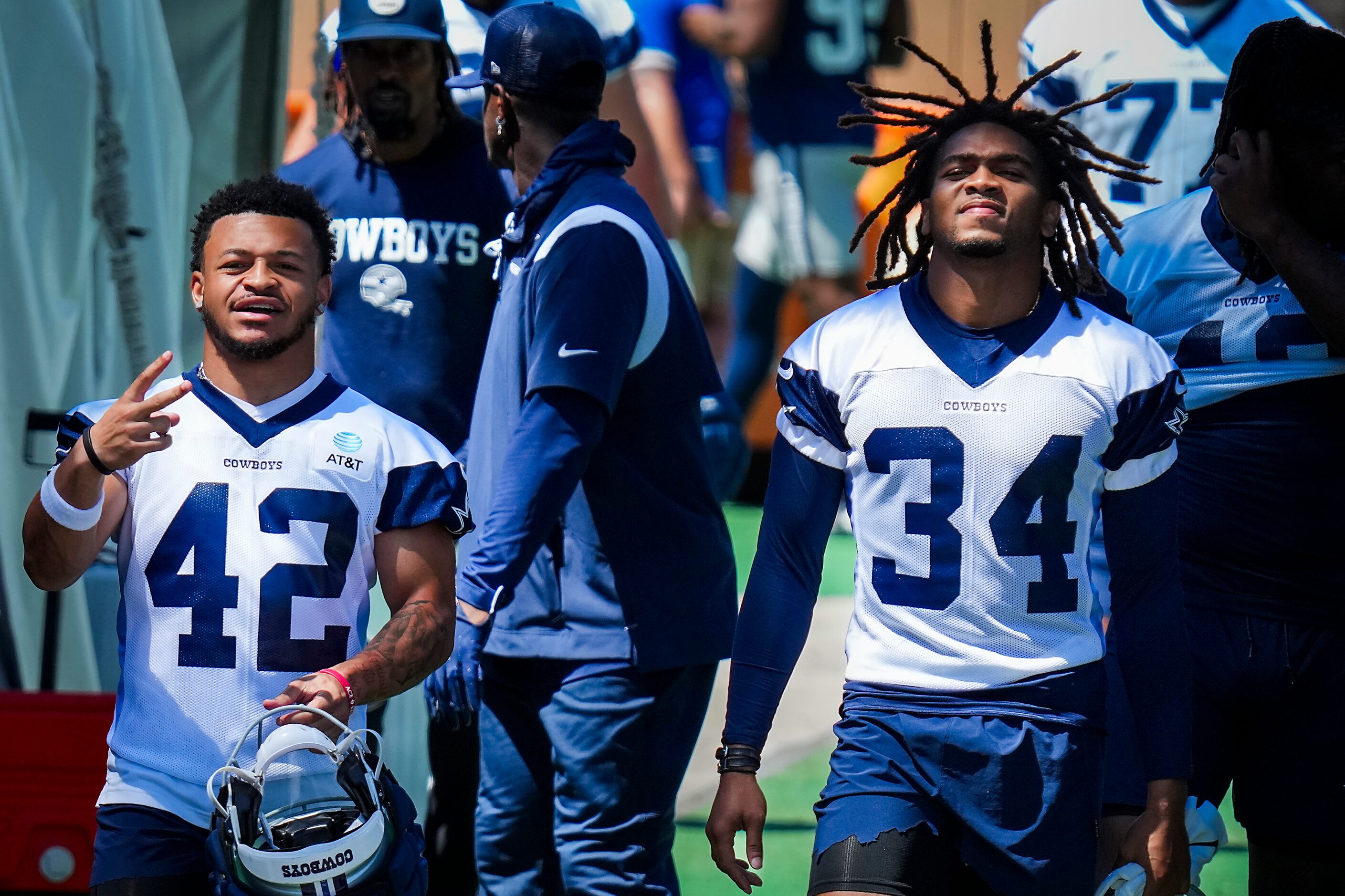 Dallas Cowboys running back Deuce Vaughn (42) motions to fans as he takes the field with...