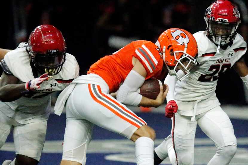 Rockwall High School quarterback Mason Marshall (16) scores the first touchdown of the game...