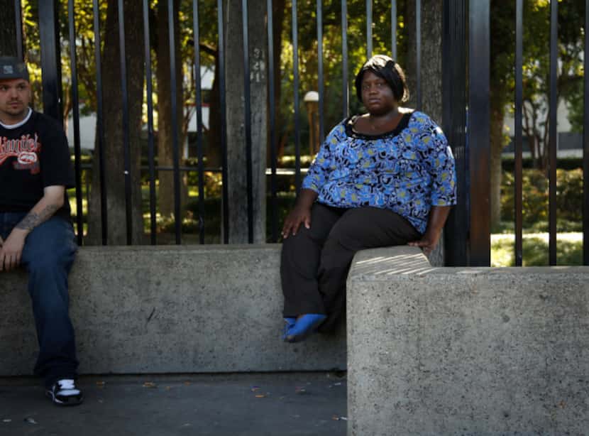 Tamica Millard sat at the DART bus stop in front of Parkland Memorial Hospital where she...