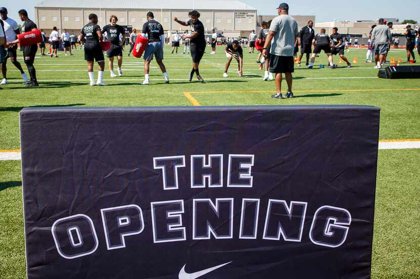 Defensive linemen run a drill during The Opening Dallas regional at at Euless Trinity High...