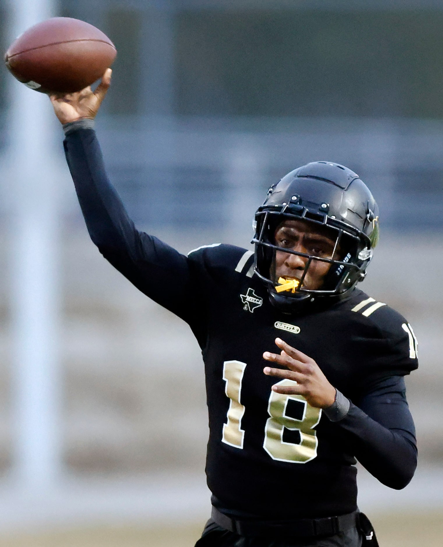 South Oak Cliff quarterback William Little (18) throws a pass against Midlothian Heritage...