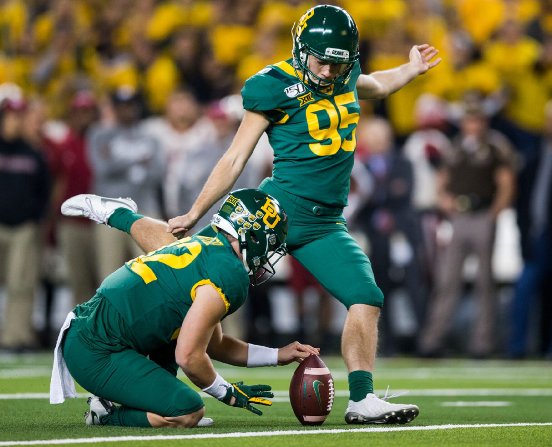 Baylor Bears place kicker John Mayers (95) kicks an extra point during the first quarter of...