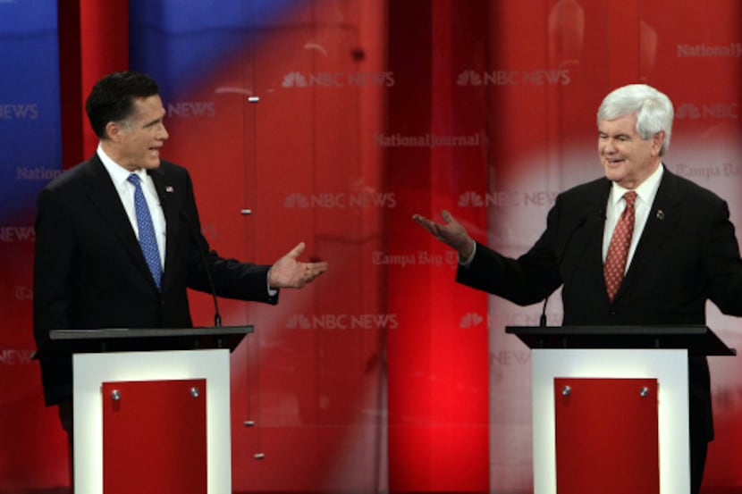 Republican presidential candidates Mitt Romney (left) and Newt Gingrich revved up during...