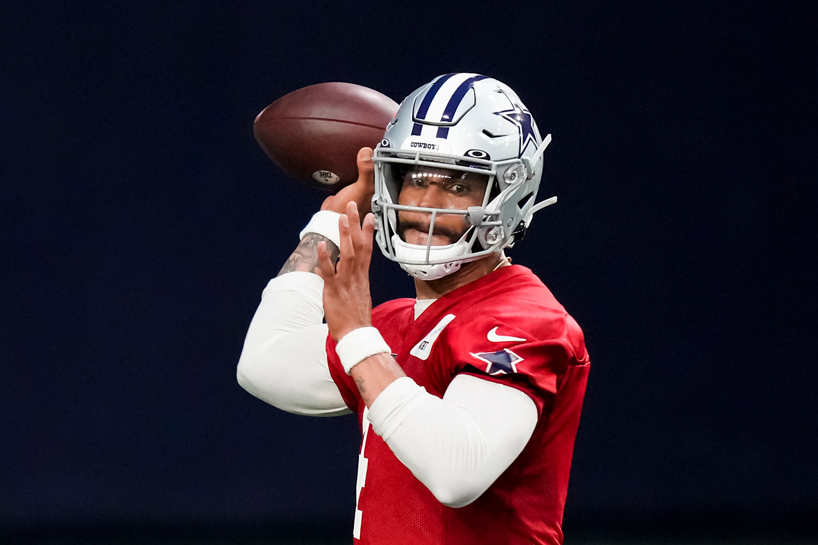 Dallas Cowboys quarterback Dak Prescott (4) throws a pass during the OTA team's practice at...