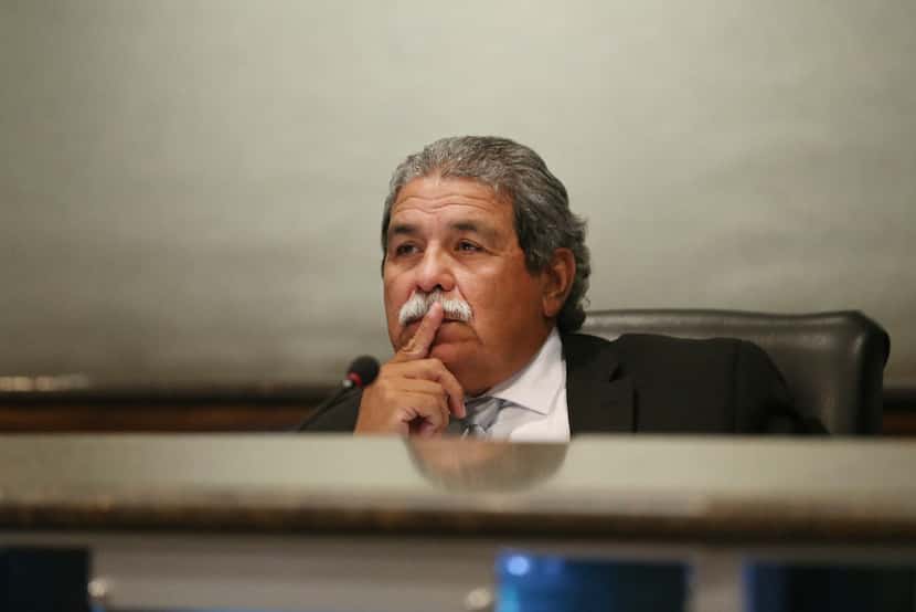 Dallas ISD Superintendent Michael Hinojosa listens during a public hearing and board meeting...