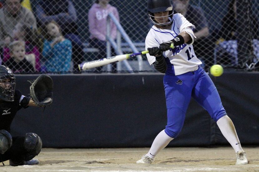 Plano West junior pitcher Sierra Lange (12) swings at a pitch during a District 6-6A game...