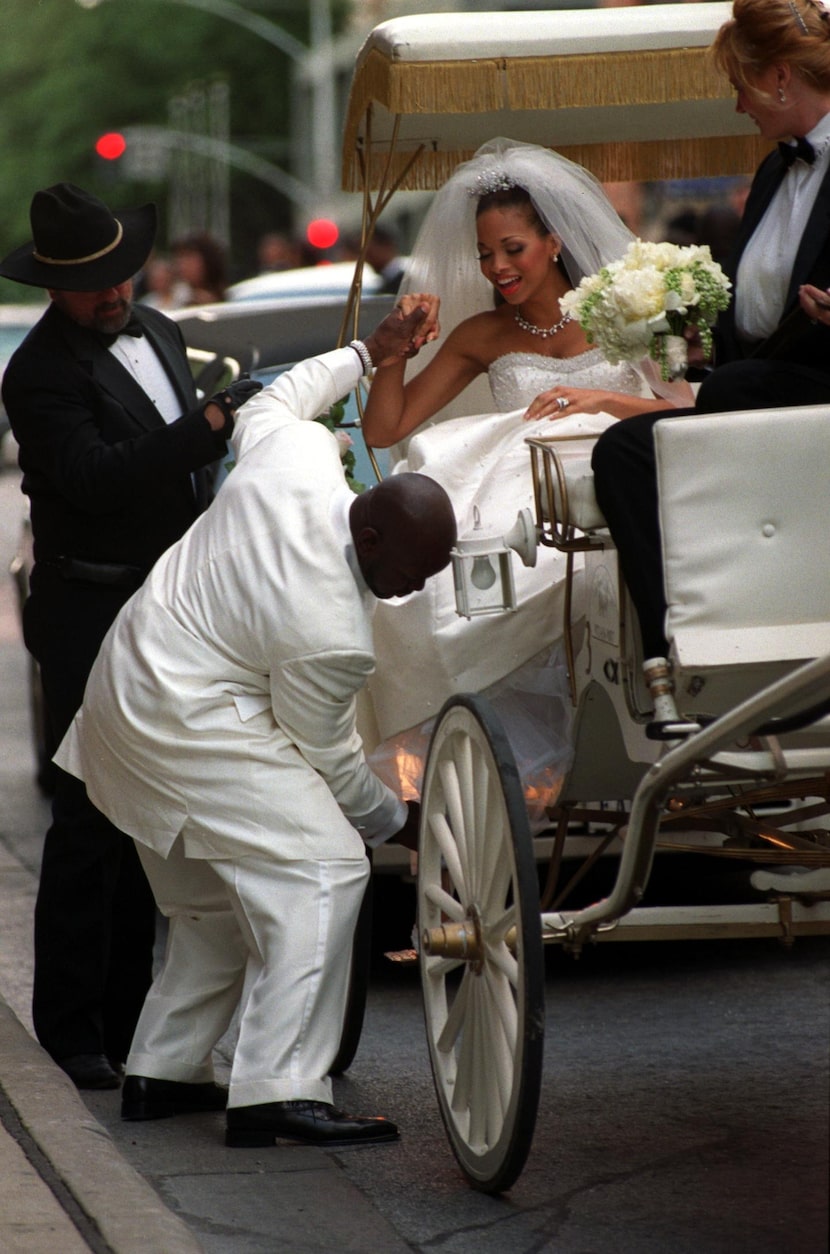 Emmitt Smith, running back for the Dallas Cowboys, and Pat Lawrence were married today....