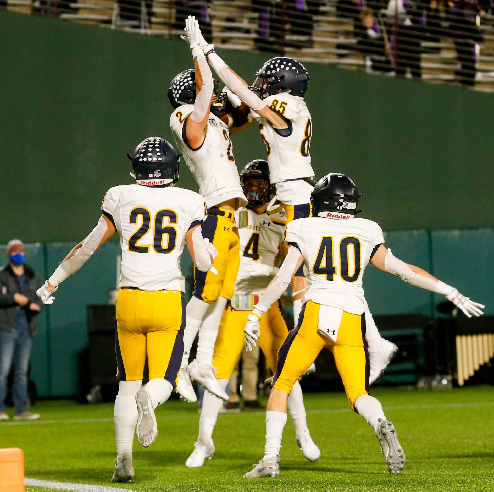 Highland Park's John Rutledge celebrate a touchdown during the first half of a Class 5A...