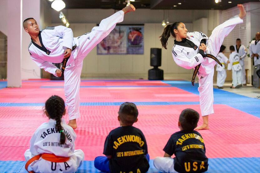 Kevin Baltazar (left) and Karla Montoya train at Lee's International Taekwondo academy on...