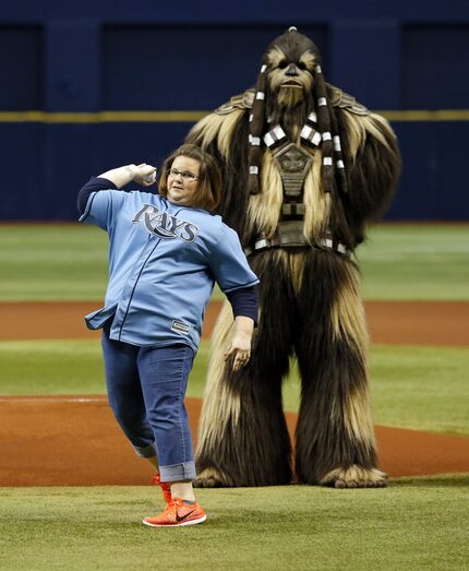 ST. PETERSBURG, FL - JUNE 11: Candace Payne, known as Chewbacca Mom, throws out the first...