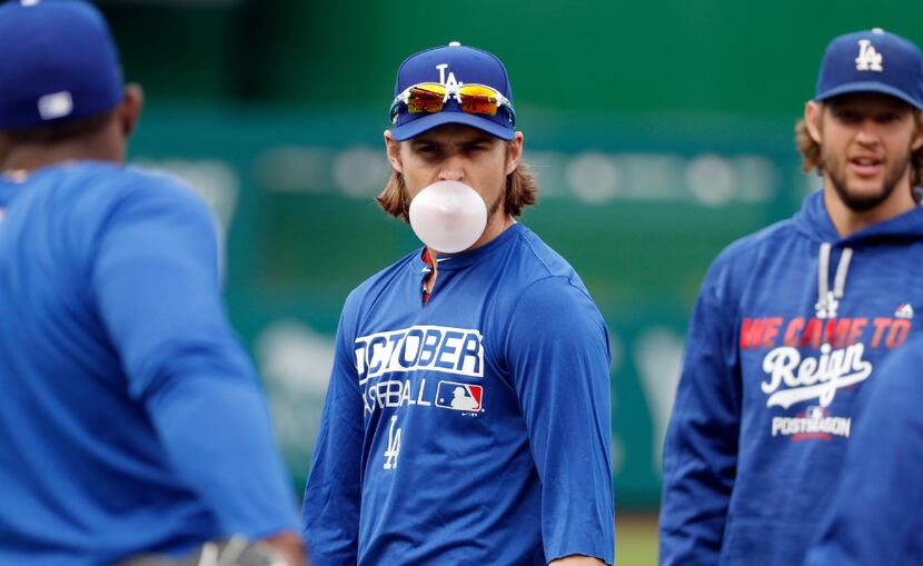 Los Angeles Dodgers right fielder Josh Reddick blows a bubble during baseball batting...