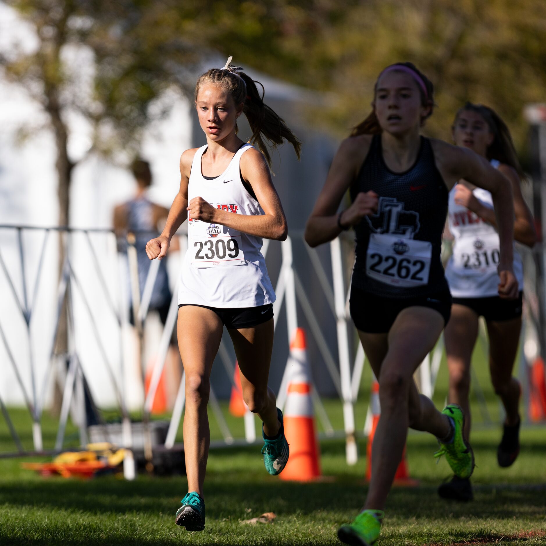 Camryn Benson of the Lovejoy Leopards runs toward the finish in the 5A girls' 3200m race...