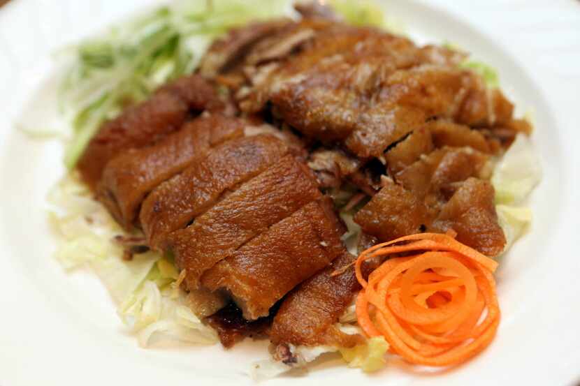 Royal China's half duck is roasted with five-spice, ginger and garlic, then flash-fried.