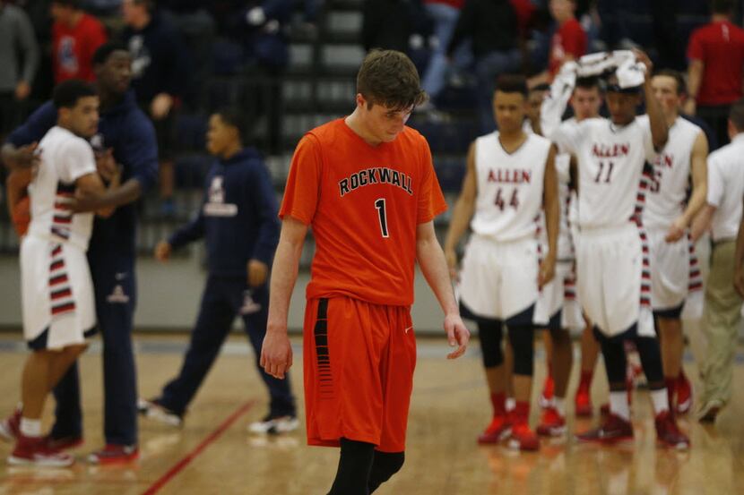 Rockwall's Austin Grandstaff (1) walks off the court after losing to Allen during their boys...
