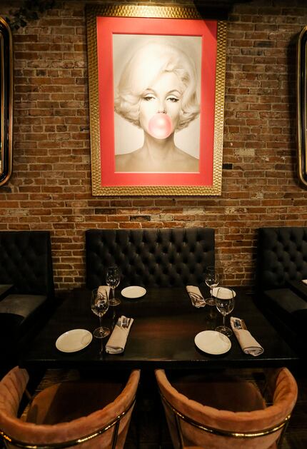 New restaurant Felix Culpa in Dallas has a wall full of art, including this print of Marilyn...