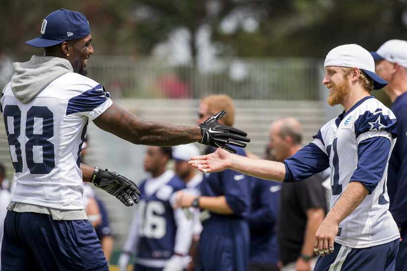 Dallas Cowboys wide receiver Dez Bryant (88) shakes hands with fellow wide receiver Cole...