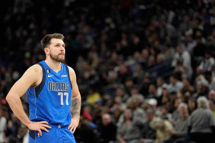 Dallas Mavericks guard Luka Doncic (77) waits for play to resume during the second half of...