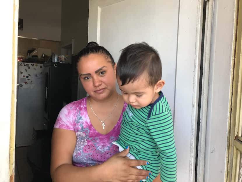 El Paso resident Maribel Chavez, 28, holds her 1 -year-old son, Lean, in the Segundo Barrio...