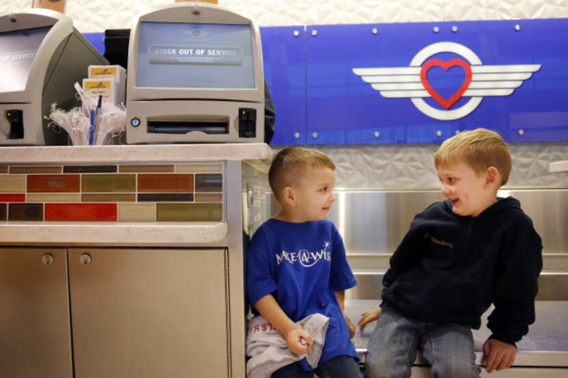 Four-year-old Karter Whittenberg (left), who has kidney disease, waited with his brother...