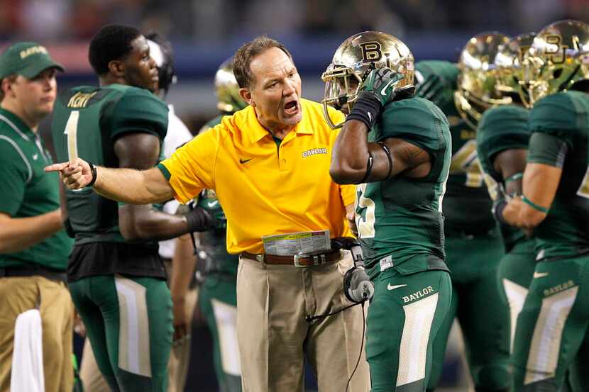 Baylor defensive coordinator Phil Bennett gets on safety Terrell Burt (13) in the third...