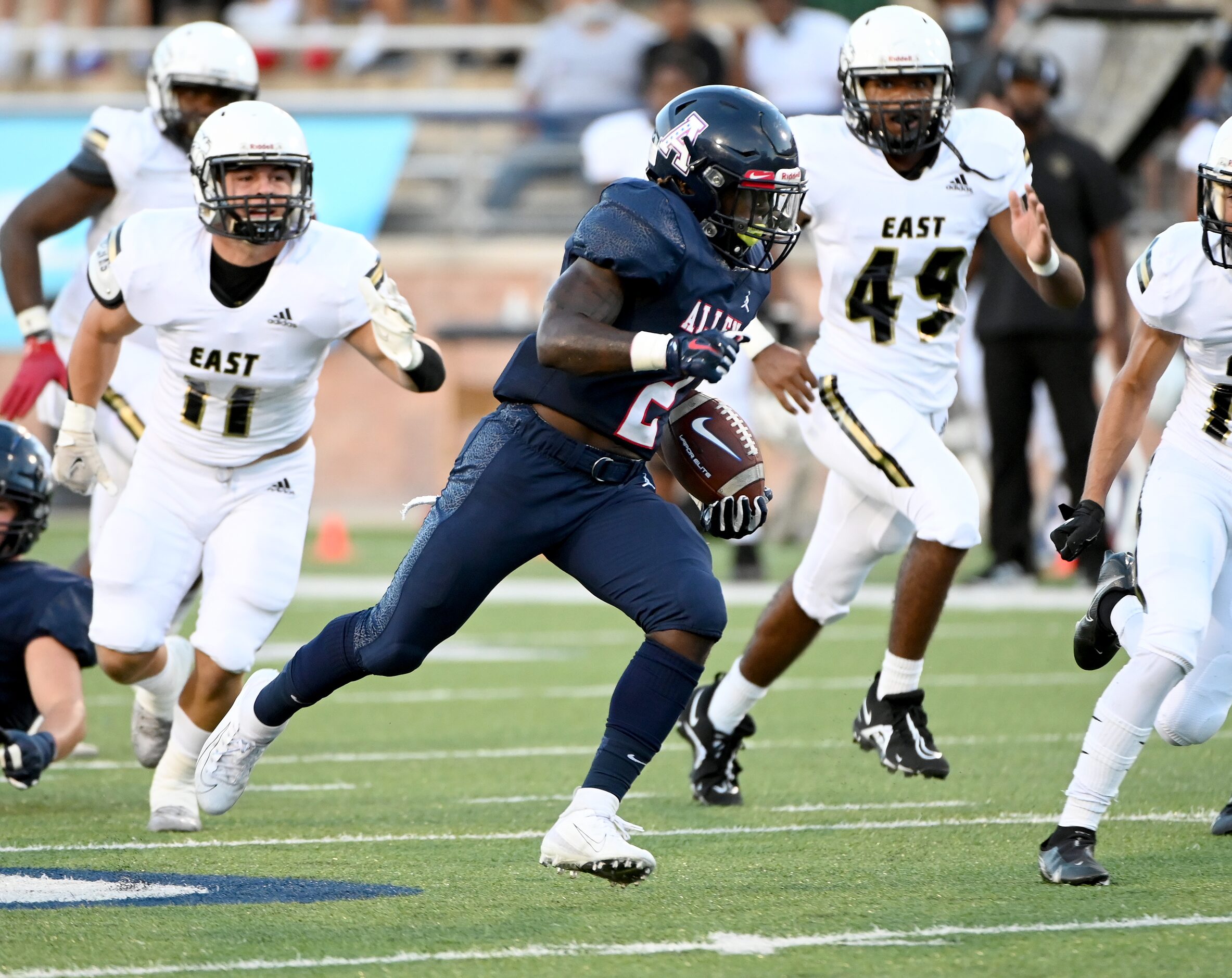 Allen’s Jaylen Jenkins (2) runs through the Plano East defense in the first half during a...